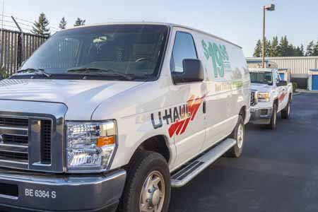Uhaul parked outside of a self storage facility.
