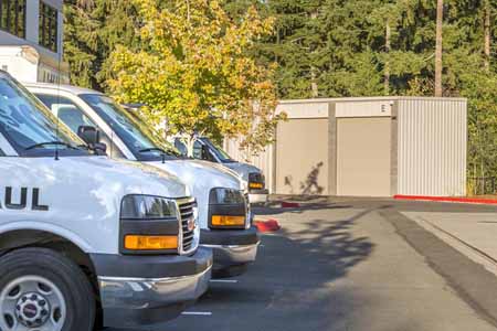 Uhauls parked outside of a drive up storage facility.
