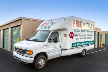 Uhaul parked outside of a self storage facility.